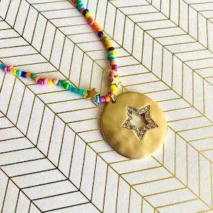 Gold Toned Round Star Cut Out Sparkling Rhinestone Encrusted Necklace Pendant on 16&quot; Multicolored Beaded Adjustable Chain