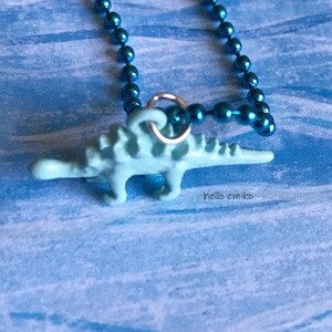 Baby Blue Enamel Stegosaurus Gold Tone Dinosaur Charm Necklace Pendant on 16 Inch Blue Metaullic Ball Chain (For Children 3 and up)