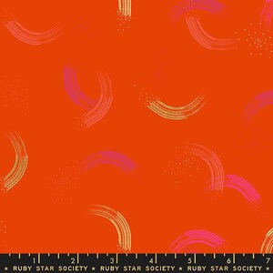 May include: Bright orange fabric with a repeating pattern of curved brushstrokes in gold, pink, and purple. Small gold dots are scattered throughout the design. The text "RUBY STAR SOCIETY" is printed at the bottom.