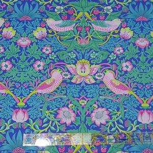 May include: A blue fabric with a repeating pattern of pink birds, green leaves, and pink flowers. The pattern is reminiscent of a traditional wallpaper design.