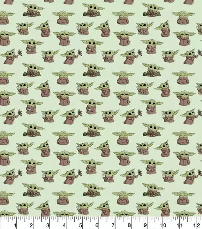 May include: A green background with a repeating pattern of a small, green, cartoon character with large ears. The character is holding a small, round object in its hands.