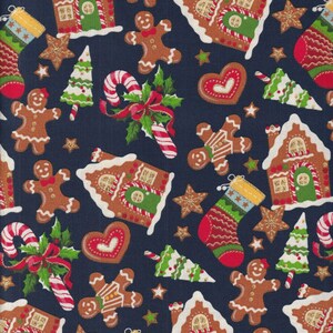May include: A navy blue fabric with a repeating pattern of gingerbread houses, gingerbread men, candy canes, Christmas trees, and stockings. The pattern is festive and whimsical.