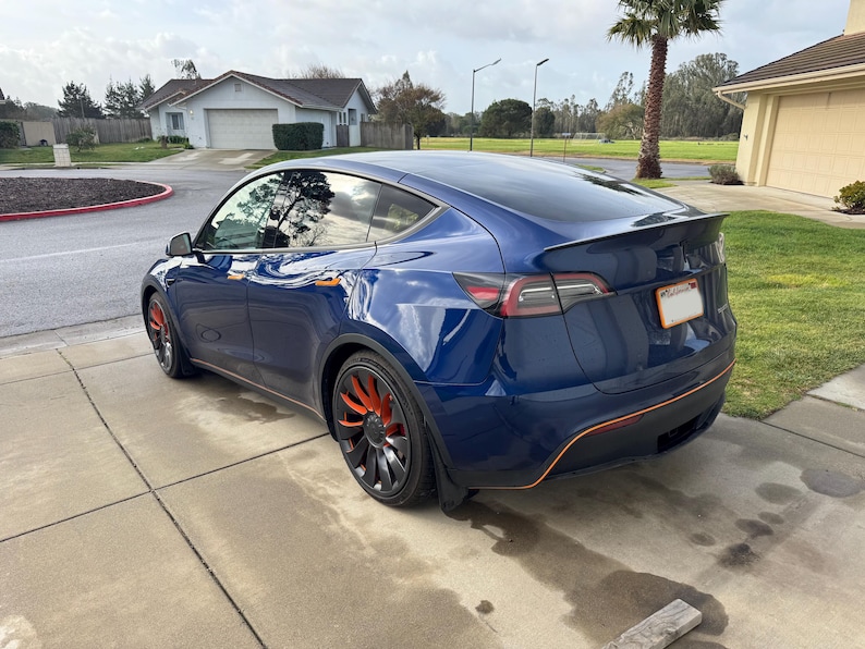 Model Y rear view with orange wheel accents
