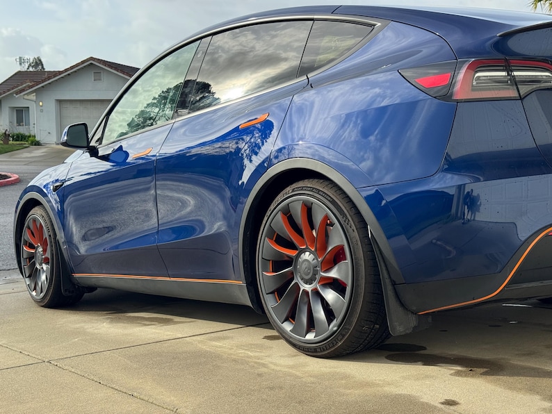 Model Y with orange and gray wheel accents