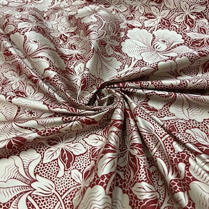Silk floral  print in mehroon and ivory color print on silk Shantung ,  54” wide fabric. Sold by the yard.