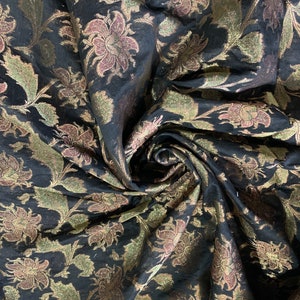 Organza Brocade Fabric 45” wide.  Beautiful black with multi gold Matalic jaquard color.  Best used for apparel and home Decore.