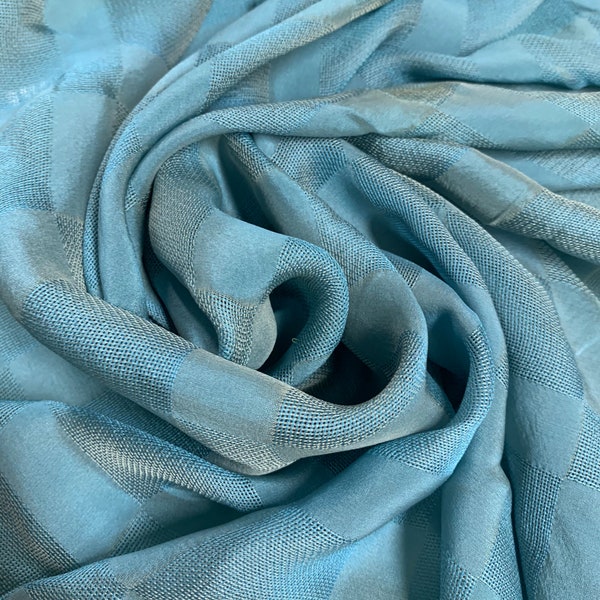 Motif à carreaux jacquard en mousseline de soie 100 %, belle couleur bleu aqua. Vendu par mètre.