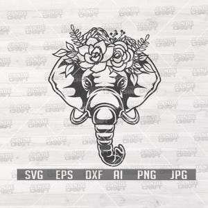 Puede incluir: Ilustración en blanco y negro de una cabeza de elefante con una corona floral. La imagen incluye el texto "SVG EPS DXF AI PNG JPG". El elefante tiene orejas grandes y una trompa detallada. La corona floral presenta rosas y hojas.