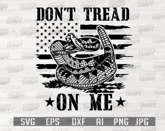 May include: Black and white graphic design of a rattlesnake coiled around a distressed American flag with the text "Don't Tread On Me".