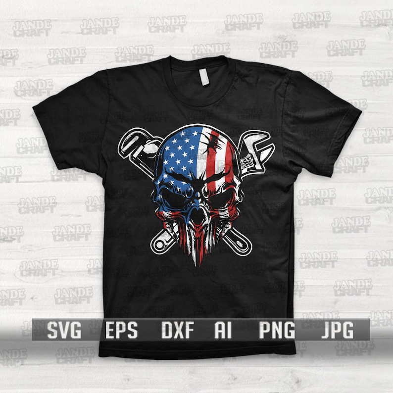 May include: A black t-shirt with a graphic of a skull with an American flag design. The skull is surrounded by two crossed wrenches.