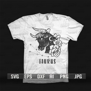 May include: A white t-shirt with a black silhouette of a bull's head with horns, roses, and stars. The text "Taurus" is printed below the image.