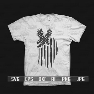 May include: A white t-shirt with a black and white distressed American flag design featuring a bald eagle with stars on its wings. The text "SVG EPS DXF AI PNG JPG" is printed below the design.