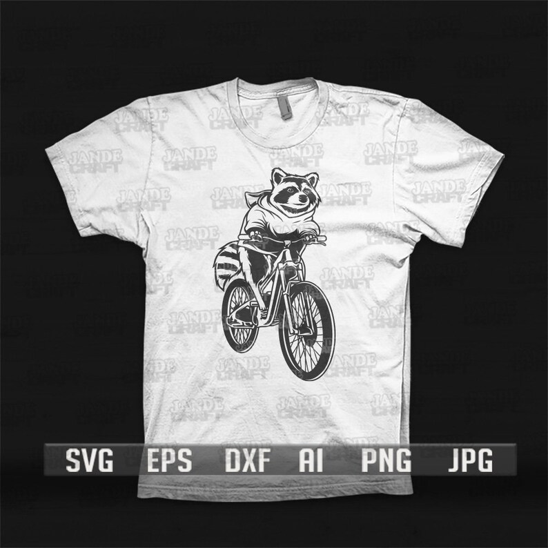May include: A white t-shirt featuring a black and white illustration of a raccoon riding a bicycle. The raccoon is wearing a hooded sweatshirt. The t-shirt has the text "JADE CRAFT" repeated on it.
