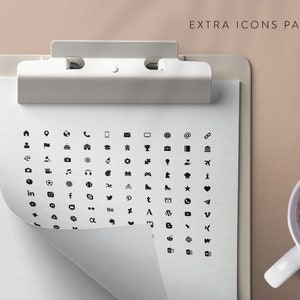 May include: A white clipboard with a black clip holds a sheet of paper with a grid of black icons. The icons represent various symbols, including social media platforms, arrows, and geometric shapes. The text "EXTRA ICONS PACK" is at the top of the sheet.