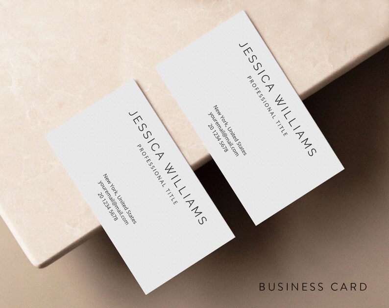 May include: A white business card with black text. The text reads "JESSICA WILLIAMS" and "PROFESSIONAL TITLE". The card also includes contact information, including an email address and phone number.
