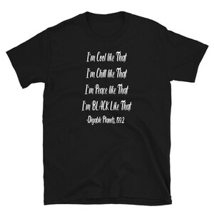 May include: Black t-shirt with white text that reads "I'm Cool like That I'm Chill like That I'm Peace like That I'm BLACK Like That -Digable Planets, 1992"