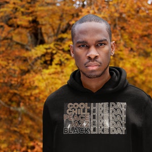 May include: A black hoodie with a white graphic print that reads "COOL LIKE DAT", "CHILL LIKE DAT", "PEACE LIKE DAT", "JAZZ LIKE DAT", and "BLACK LIKE DAT".