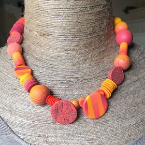 Necklace of beads in orange tones, beads entirely modeled by hand in unique model polymer paste.