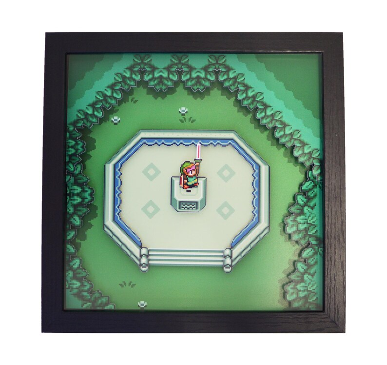 May include: Framed pixel art depicting a scene from a video game. The artwork features a character holding a sword on a platform surrounded by a green landscape. The frame is black, and the overall design is reminiscent of classic 8-bit graphics.