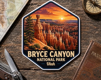 May include: A hexagonal sticker featuring a vibrant illustration of Bryce Canyon National Park in Utah at sunset, with orange rock formations, a pine tree, and the text BRYCE CANYON NATIONAL PARK Utah displayed in bold lettering at the bottom.