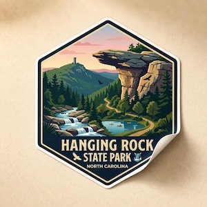 May include: A hexagonal sticker featuring a scenic illustration of Hanging Rock State Park in North Carolina. The design includes a waterfall, lake, mountain, and the text "Hanging Rock State Park North Carolina". The sticker has a white border and a slight peel.