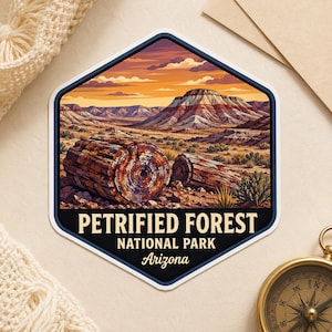 May include: A hexagonal sticker featuring a landscape of Petrified Forest National Park in Arizona. The illustration shows petrified wood logs in the foreground with desert mountains under a sunset sky. Text reads PETRIFIED FOREST NATIONAL PARK Arizona.
