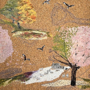 May include: A cork surface featuring a printed landscape illustration with black topographic contour lines and elevation numbers. The scene includes pink cherry blossom trees, green and yellow foliage, flying birds, and a small stone cottage with sheep.