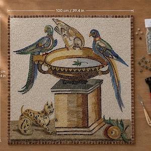 May include: A square mosaic art piece measuring 39.4 inches by 39.4 inches, depicting two parrots perched on a pedestal bowl, a cat, and fruit. Included are a bag of loose mosaic tiles, a metal palette knife, and red-handled nipping pliers.