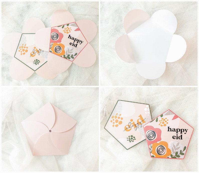 May include: A pink paper card with a floral design and the text "happy eid" in a white font. The card is folded into a flower shape.