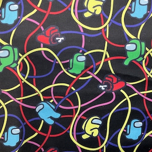 May include: A black fabric with a repeating pattern of colorful Among Us characters and colorful lines. The characters are in various poses, including walking, standing, and waving.