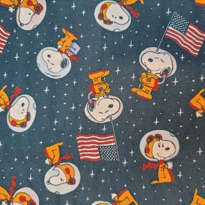 Cotton Fabric - Peanuts Snoopy Space Toss with American Flag on Blue - Select Your Size or By The Yard - 100% Cotton Fabric