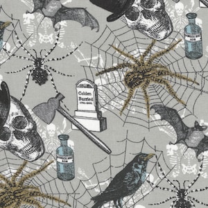 May include: A gray and white fabric with a Halloween theme. The fabric features a repeating pattern of skulls, spiders, bats, and crossbones. The fabric also includes a tombstone with the text "Golden Buried 1793-2001".