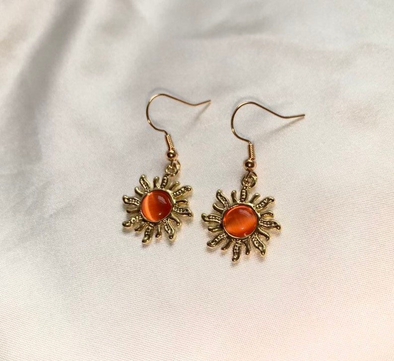 Cool gold plated sun earrings with orange centre on 18k gold plated hooks