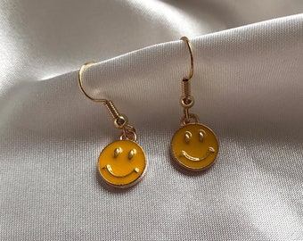 Adorable cute quirky fun little yellow smile face drop dangle earrings on a 18k gold plated hook