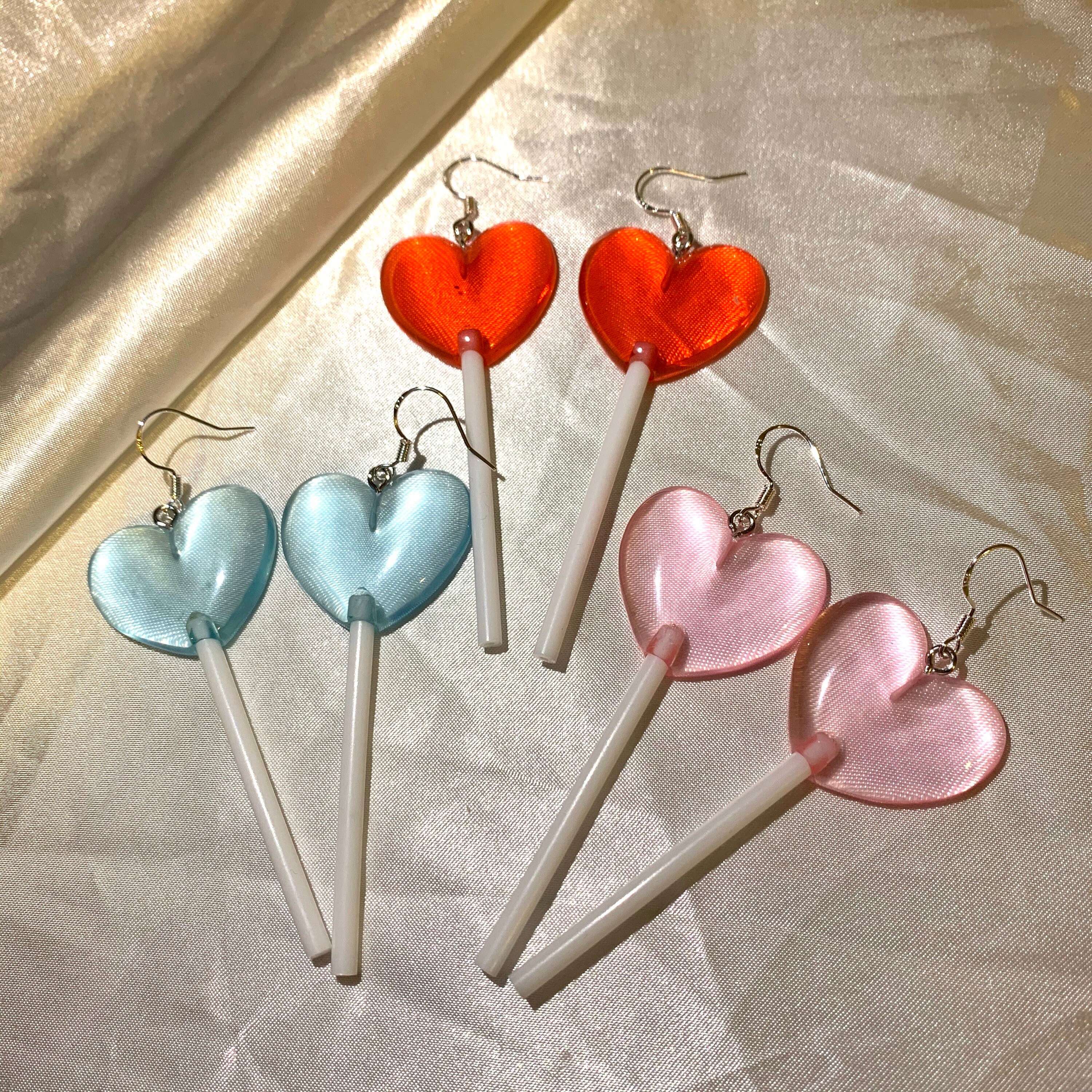Heart sucker earrings deals