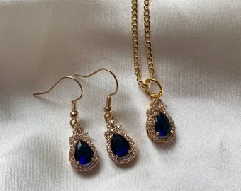 Beautiful dark blue/ navy glass crystal with silver rhinestones. Available as earrings, necklace or jewellery set. Handmade 14k gold plated