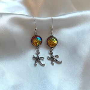 Cool silver handmade beach inspired starfish earrings with yellow holographic scale detailing