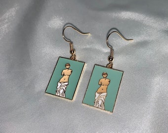 Cool quirky goddess Greek body statue bust on blue green back earrings on a 18k gold plated hook
