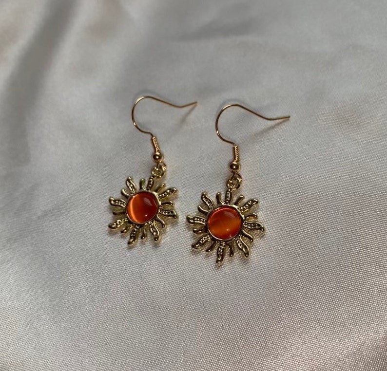Cool gold plated sun earrings with orange centre on 18k gold plated hooks