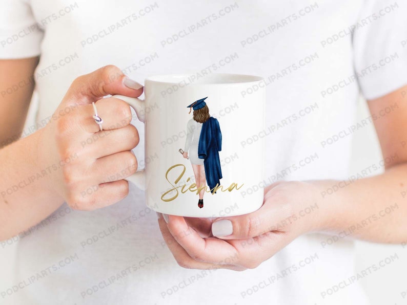 May include: White ceramic mug with a graduation cap and gown illustration. The text "Sienna" is written in gold script on the mug.