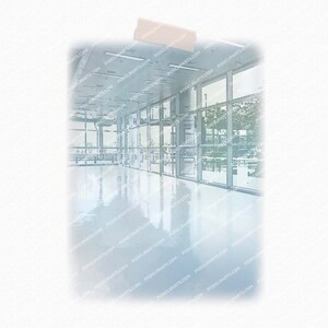 May include: A large, empty room with a white tiled floor and large windows. The windows are reflecting the outside world, creating a blurred image of trees and buildings.
