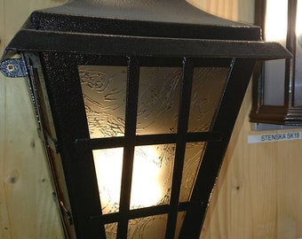 Forged wall lantern