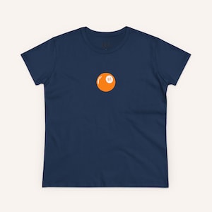 May include: A navy blue t-shirt with a single orange billiard ball with the number 81 on it.