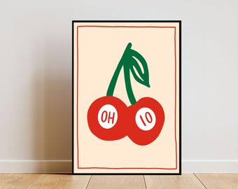 May include: A framed illustration of two red cherries with green stems. The cherries have the words "OH" and "IO" written on them.