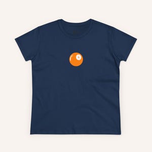 May include: A navy blue t-shirt with a single orange billiard ball with a white number 4 on it.