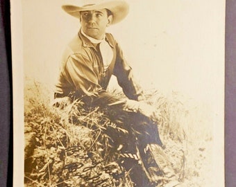 Vintage buck jones sitting boots & spur showing best of luck buck jones photo s1