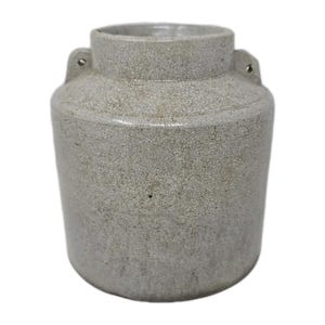May include: A cylindrical, off-white ceramic jar with a textured, crackled surface. The jar has a wide opening, a slightly narrower neck, and two small loop handles. The overall shape is simple and functional, suggesting a vintage or rustic aesthetic.