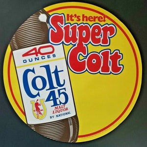 May include: A yellow and red circular sign with the text "It's here! Super Colt" and a brown bottle with the text "40 ounces Colt 45 Malt Liquor by National" on it.