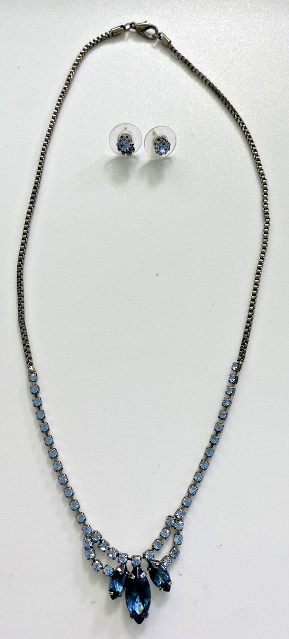 Gunmetal tone and blue jeweled necklace and earrin