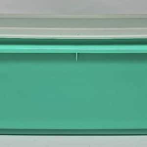 May include: A rectangular, teal-colored plastic container with a translucent white lid. The container has a slightly curved base and a raised rim. The lid fits snugly on top, creating an airtight seal. This storage container is ideal for food or other household items.